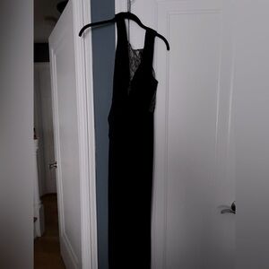 Formal black dress with mesh accents and slit